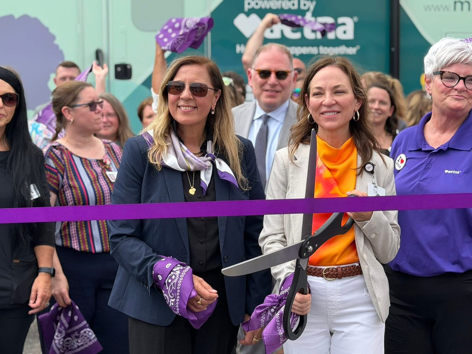 Cutting the purple ribbon at the Care Connect launch